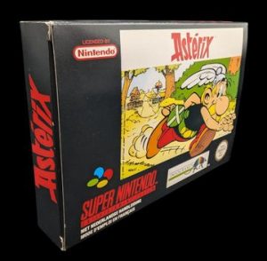 Nintendo - Super NES - Jeu Astérix. Avec boîte, notices, poster, sachet de protection, cale en carton. Version du jeu FAH.