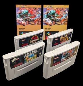 Nintendo - Super NES - Lots de 4 jeux : Street Fighter II, Joe & Mac,.Jurassic Park, Snaq-Fu. Cartouches seules, avec deux notices Street Fighter II. Versions des jeux FAH.